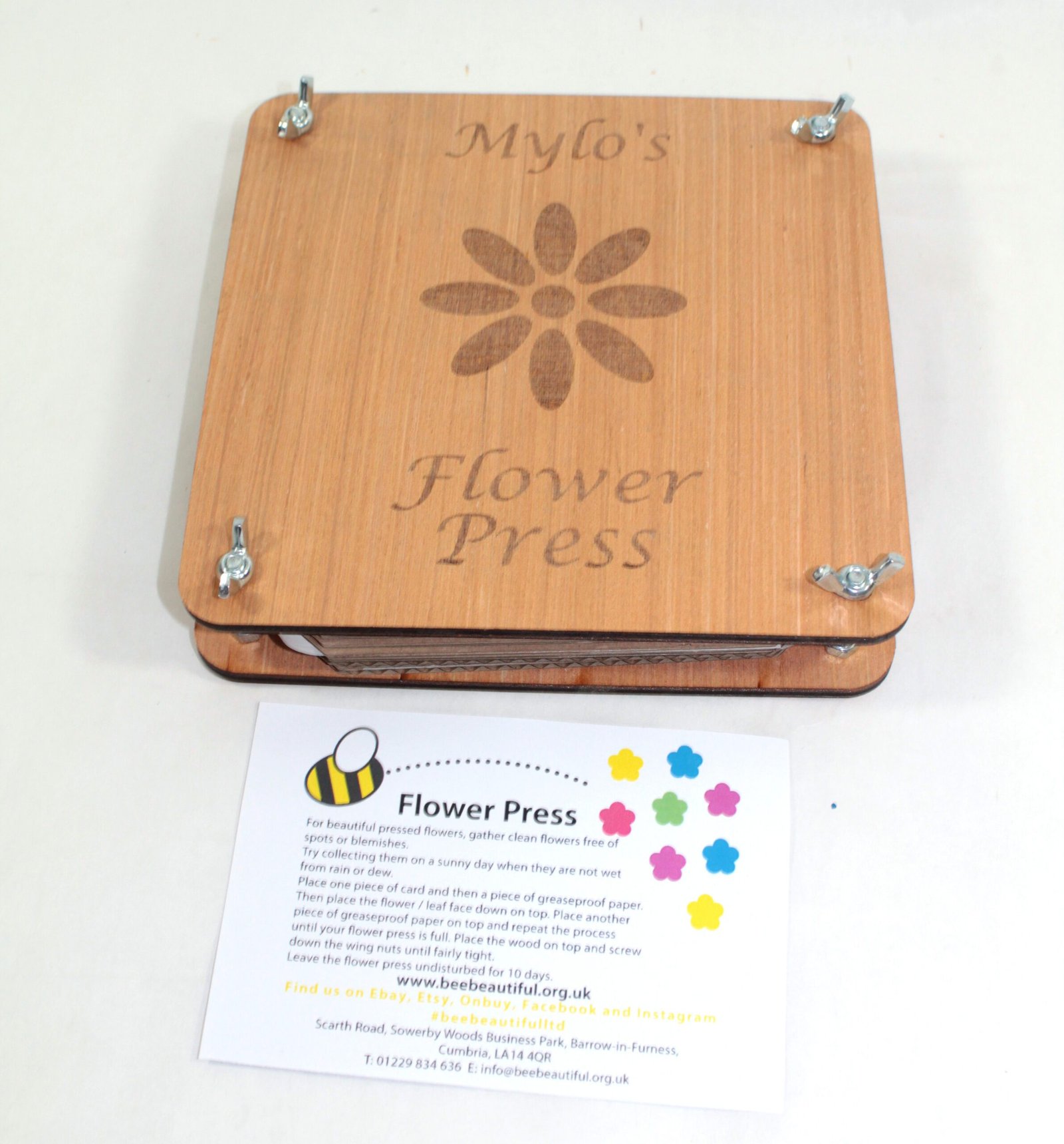 front of personalised flower press with leaflet