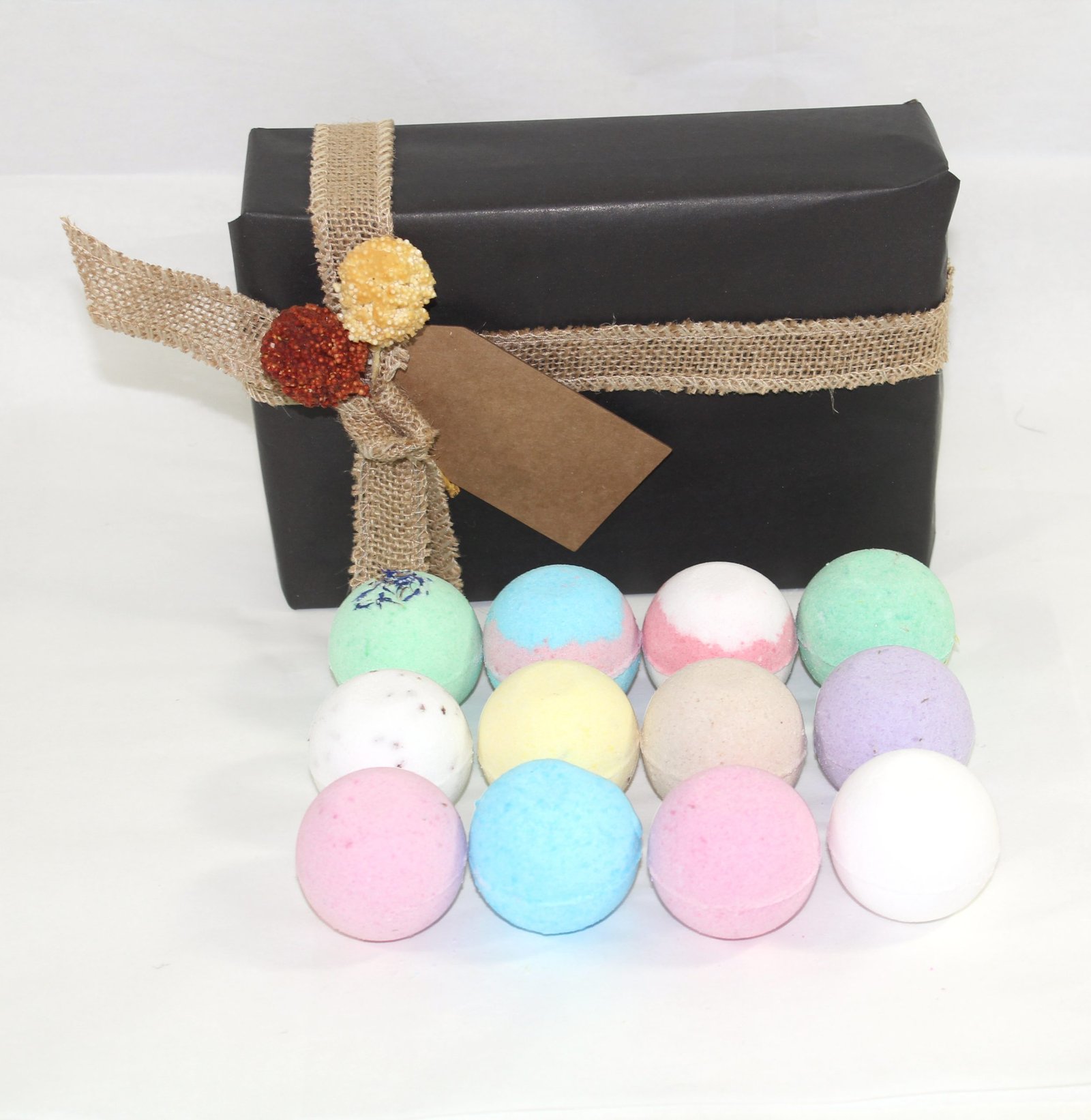 black gift wrap with bath bombs in front