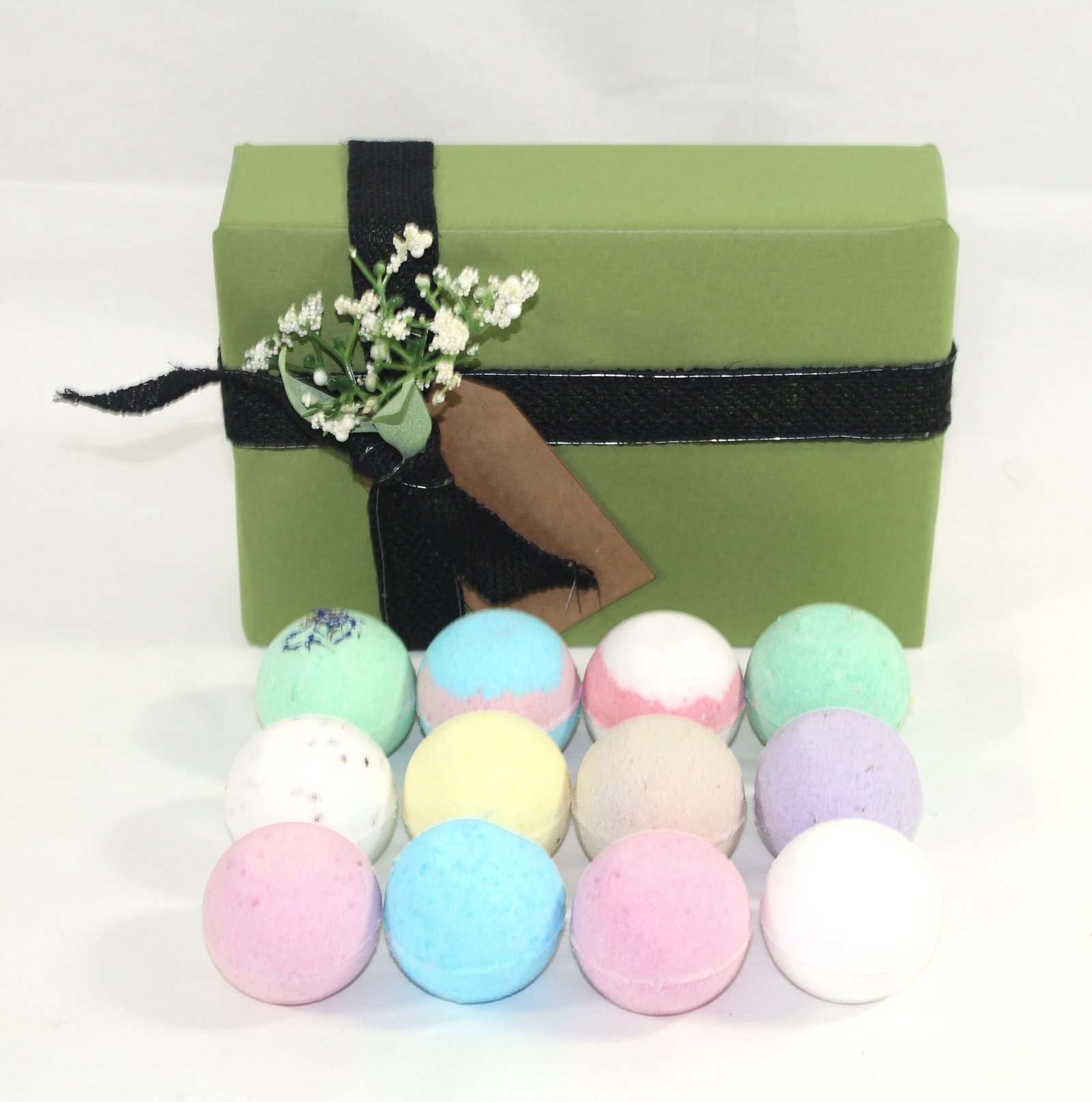 green gift wrap with bath bombs infront
