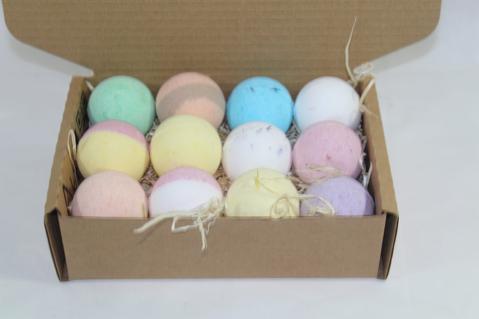 close up of bath bombs in box with open lid